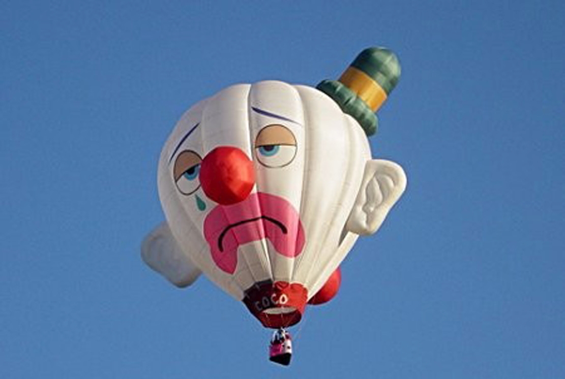 Clowns balloons. Clown in Balloon. Clown on a Balloon. Clown Balloon. Focus Clown and Balloon.